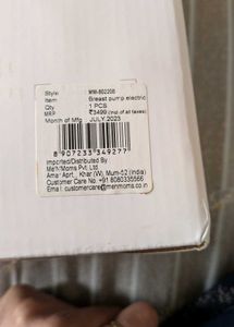 Electric Breast Pump With Feeding Bottle.