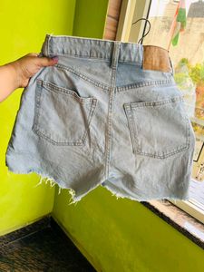 H&amp;M light blue washed ripped shorts