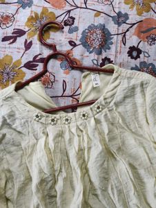 Ruffled Top with Neckline Embellishment