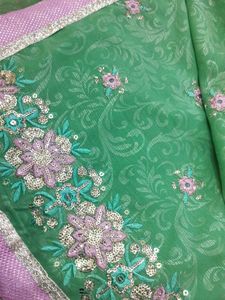 shimmery green two way net and Georgette saree