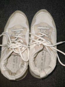 Vintage-Style Off-White Sneakers