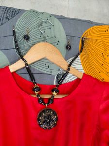 Red Frock With Black Accessories