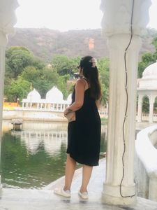 Black strapped one piece