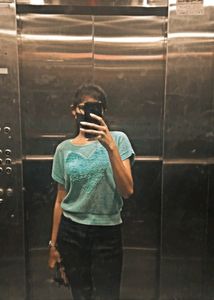 sea green top . It looks cute