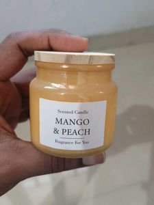 Unused Mesmerizing  mango peach scented candle