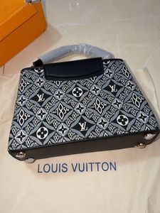 Louis Vuitton Capucine Handbag with sling belt