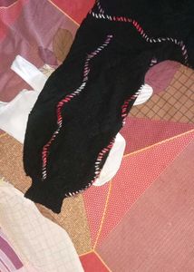 Cozy Black Knit Sweater with Wavy Trim