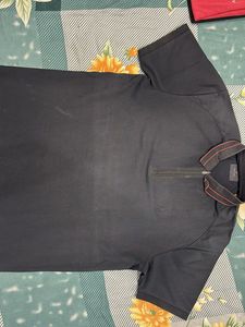 Stylish Black Polo with Unique Detail