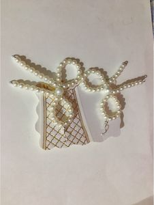 Pearl Bead Bow Dangling Earrings