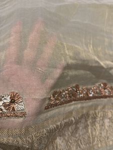 designer blouse piece in soft gold with hand work