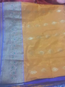 mango colour saree with ready stitched pattern blouse....