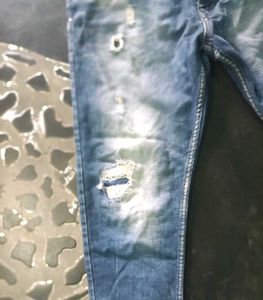 Distressed Blue Denim Jeans