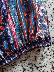 Patterned top traditional goes with black skirt
