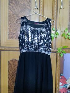 Black slip dress, ankle length.