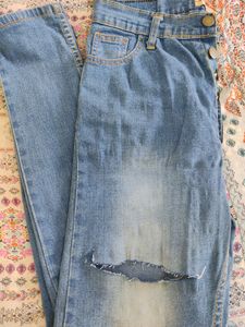 Light Blue Ripped Jeans... Condition--9/10...Size-