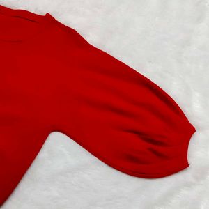 red woolen top