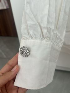 Classic white shirt with embellishments