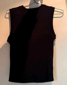 This is a black sleeveless top, specifically