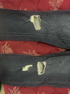 Ripped Dark Blue Jeans
