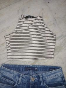 striped halter crop top and blue ripped jeans