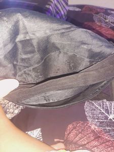 Black color embroided and studded sling bag