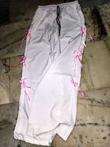 White Pants with Pink Ribbon Detail