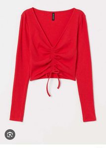 branded red long sleeves crop top.
