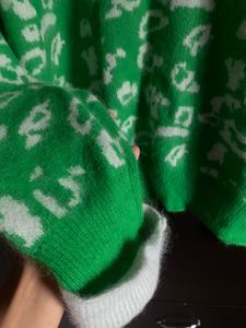 Green Jumper with White Accents