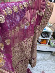 Heavy Work Purple Net Saree With Shiny Petticoat.