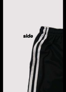 Black wide-leg pants with sporty side stripes 🤍
