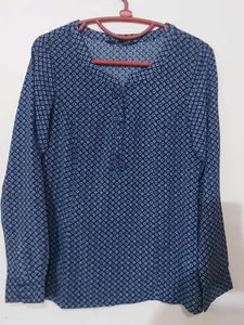 Blue Printed Georgette Top With Fold Up Sleeves.