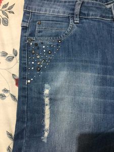 Slim Fit Distressed Denim.