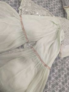 A Light green Sharara suit