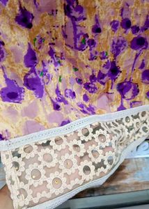 Light Voilet Embroidered Sleeveless Kurti