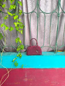 Maroon Shimmery Mini Handbag.