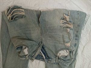 damaged jeans .