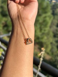 golden libra sign chain