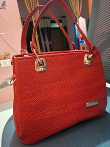 Stylish textured red handbag for women