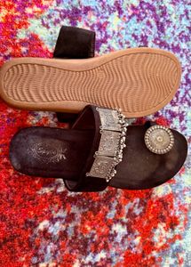 Elegant Black Ethnic Sandals with Ornate Silver Em