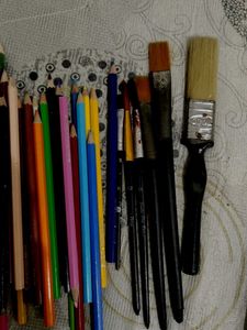 Colour Pencils And Paint Brushes