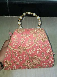 Elegant Pearl Handle Clutch