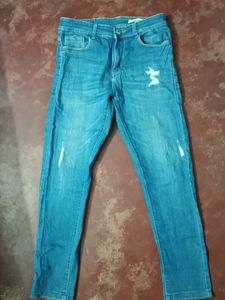 Distressed Denim Jeans With Scratches