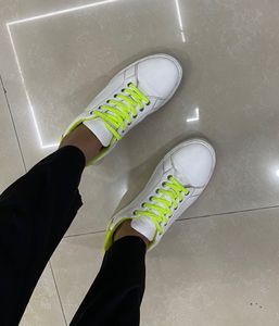 White Sneakers with Neon Green Accents