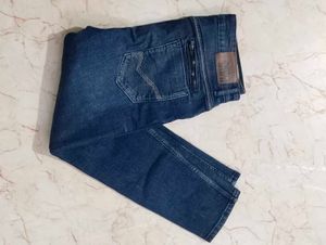 Distressed Blue Denim Jeans