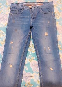 Distressed Blue Denim Jeans