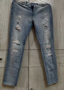 Light Blue Distressed Slim Fit Jeans.