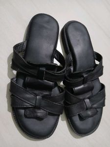 Black leather slides