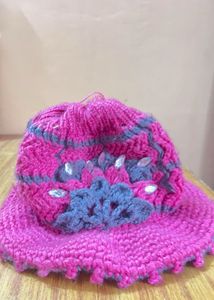 Handmade Crocheted Hat with Floral Embellishment