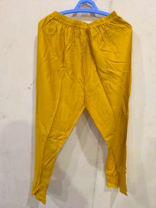 Mustard churidar pant.
