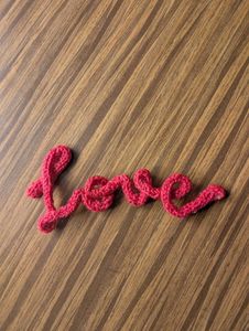 Pink Knitted &#39;Love&#39; Sign